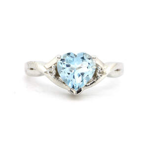 Срібна каблучка 925 проби 3,04 гр. з швейцарським блакитним та білими топазами 2,08 карат