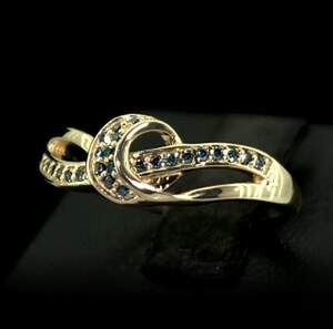 Срібна каблучка 925 проби в позолоті 750 проби 2,77 г з блакитними Діамантами Норе VVS1 0,21 карат