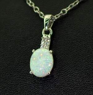 Срібна підвіска 925 проби 1,22 г з білим гідротермальним Опалом та цирконами 1,13 карат