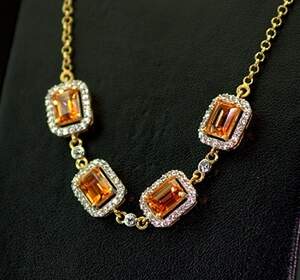 Серебряное колье 925 пробы 8,51 гр. с Кварцами Падпараджа и топазами из США 4,81 карат Серебряное колье 925 пробы 8,51 гр. с Кварцами Падпараджа и топазами из США 4,81 карат