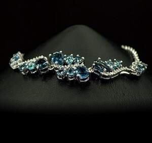 Серебряный браслет 925 пробы 4,94 гр. с голубыми шри-ланкийскими Сапфирами класса АААА и топазами из США 5,9 карат Серебряный браслет 925 пробы 4,94 гр. с голубыми шри-ланкийскими Сапфирами класса АААА и топазами из США 5,9 карат