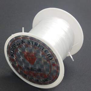 Слоеная силиконовая нить резинка (плоская) для бижутерии 1мм, Белая - 9м Слоеная силиконовая нить резинка (плоская) для бижутерии 1мм, Белая - 9м