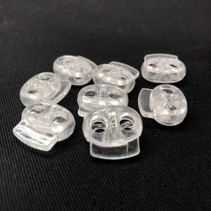 Фиксатор для шнура пластиковый 19 мм, прозрачный Фиксатор для шнура пластиковый 19 мм, прозрачный