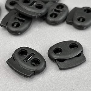 Фиксатор для шнура пластиковый, черный 22 мм