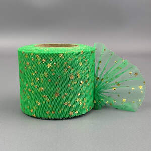 Фатин в рулонах 6см, моток 22 м - зеленый с золотыми звездами Фатин в рулонах 6см, моток 22 м - зеленый с золотыми звездами
