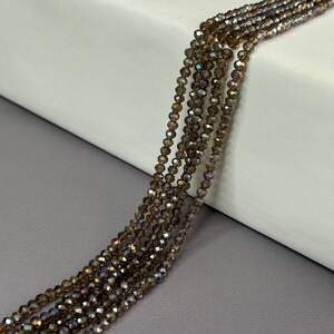 Бусины хрустальные рондель 4х3мм, нить-130 шт, раухтопазовый прозрачный с АВ Бусины хрустальные рондель 4х3мм, нить-130 шт, раухтопазовый прозрачный с АВ