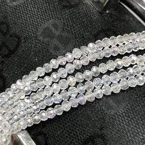 Бусины хрустальные рондель 4х3мм, нить-135 шт, прозрачный с покрытием АВ Бусины хрустальные рондель 4х3мм, нить-135 шт, прозрачный с покрытием АВ